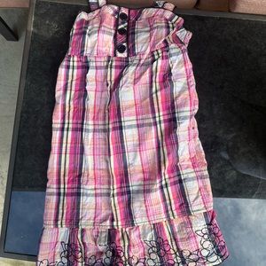 Pink dress with embroidered flowers at the bottom